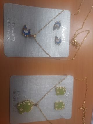 Juegos collar delfín y dinosaurio en acero