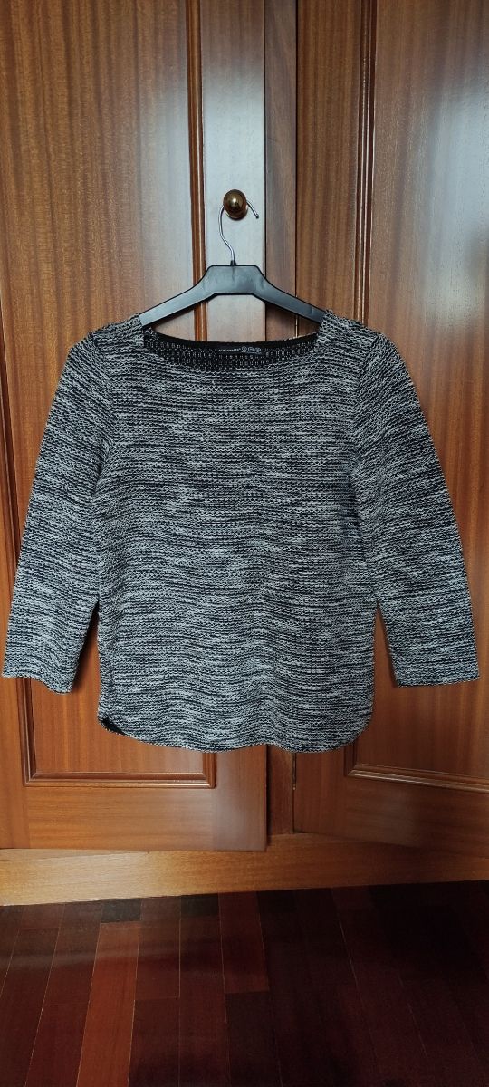 Jersey negro. Suéter. Punto. Manga larga.