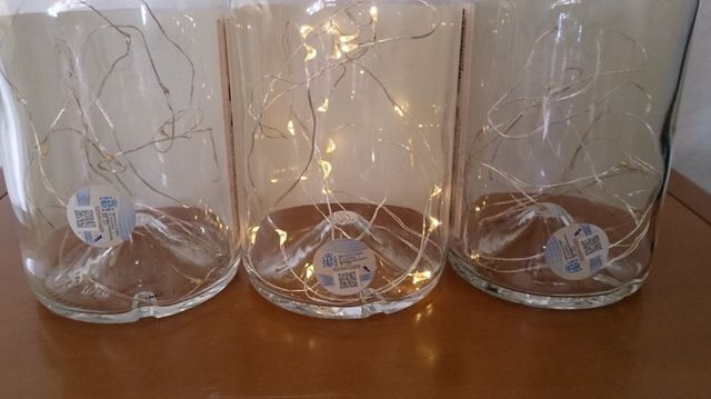 Bottiglie Otyum con luci