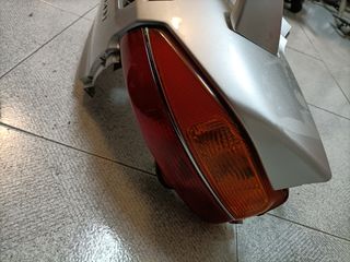 Tapa lateral Suzuki burgman 650