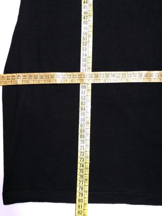 Mini vestido de punto negro. Ver medidas