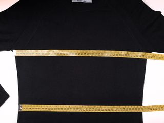 Mini vestido de punto negro. Ver medidas