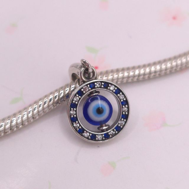 Charm Ojo protector giratorio