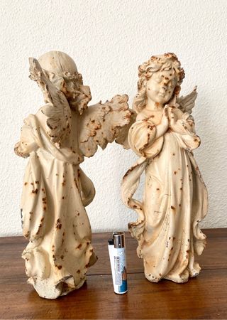 pareja de hadas en hierro fundido