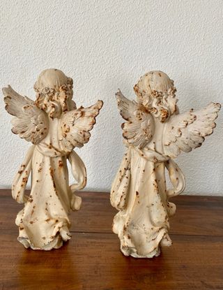 pareja de hadas en hierro fundido