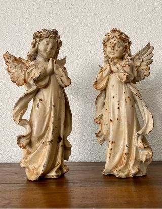 pareja de hadas en hierro fundido