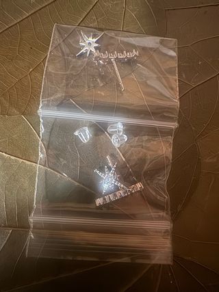 pendientes alargados con estrella colgante