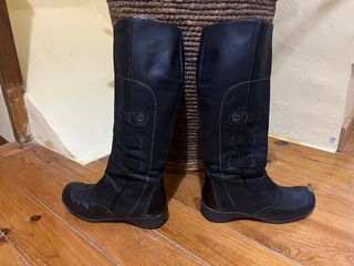 Botas altas en piel negra
