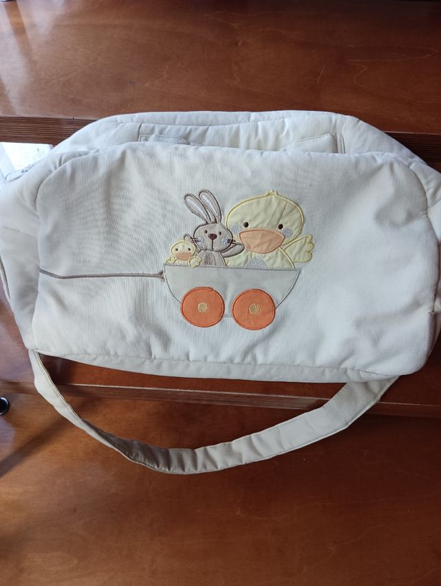 Bolsa bandolera de bebé.