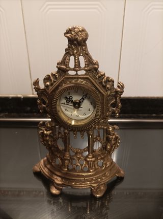 Reloj y candelabros bronce