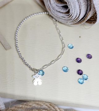 Pulsera combinada detalle oso y piedra plata