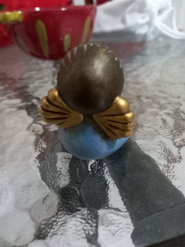 THUN Angelo seduto con cuore oro.