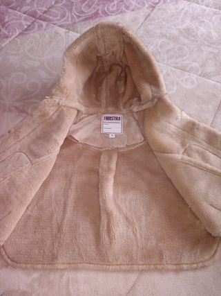Capa ante niña