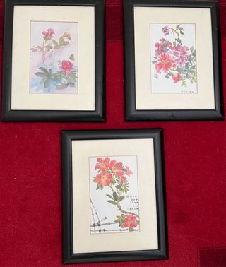 três quadros com gravuras orientais