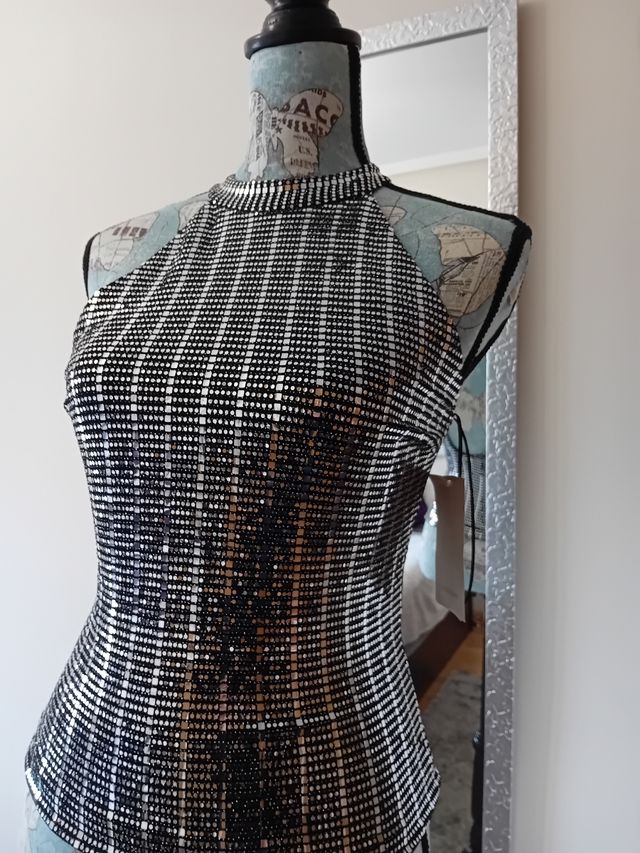 E109-Top plateado fondo negro