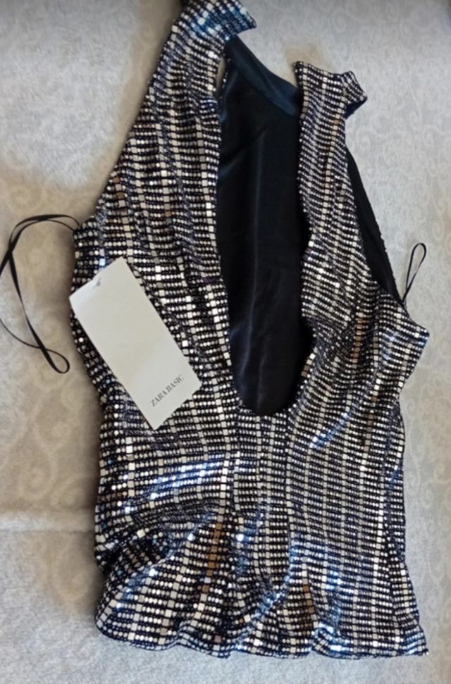 E109-Top plateado fondo negro