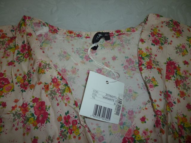 Tutina rosa con fantasia a fiori