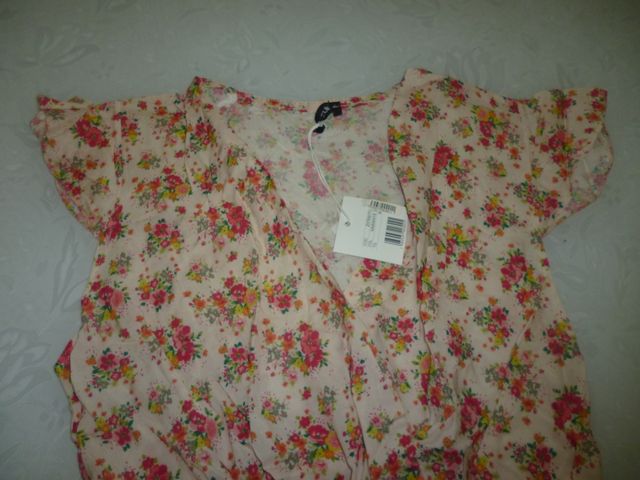 Tutina rosa con fantasia a fiori