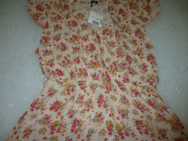 Tutina rosa con fantasia a fiori