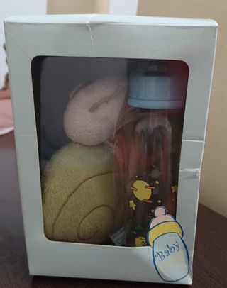 Biberón y porta chupete