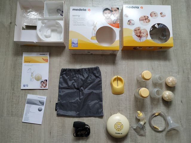 Sacaleches Medela Swing con 2 biberones y extras