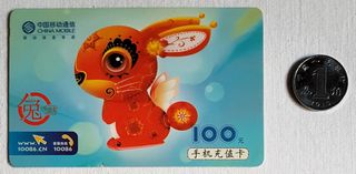 Tarjeta telefónica (conejo) y moneda chinas