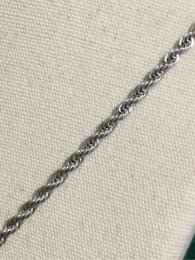 cordón mas colgante de cruz en acero.