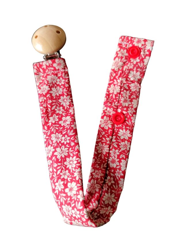 Porta ciuccio con fiori rossi