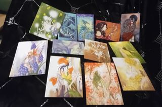 Caja portafotos con 12 postales hadas