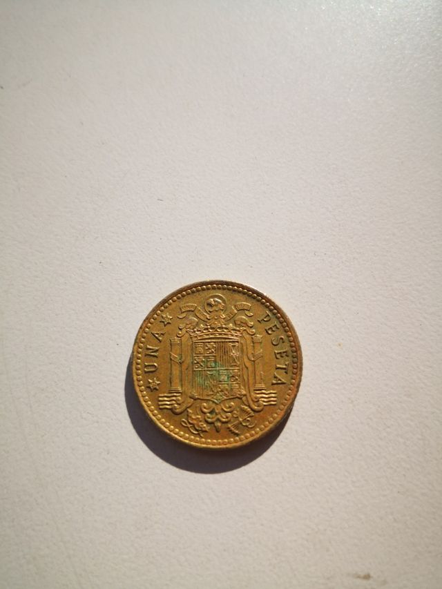 UNA PESETA