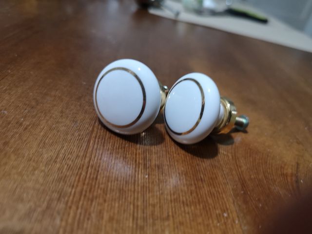 2 pomos blanco y oro