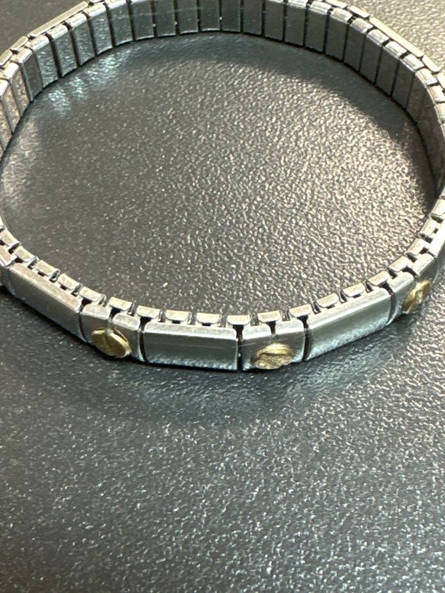 Pulsera  acero inoxidable  y piezas baño en oro