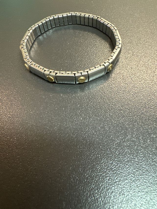 Pulsera  acero inoxidable  y piezas baño en oro