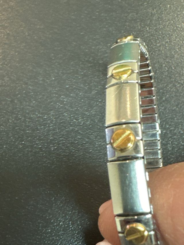 Pulsera  acero inoxidable  y piezas baño en oro