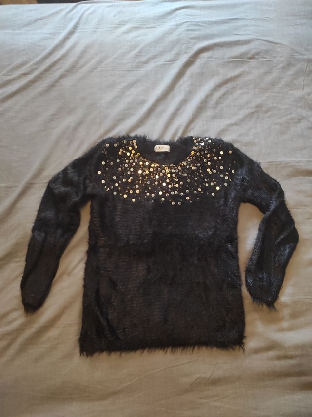 Jersey talla 8-10 años, con lentejuelas.