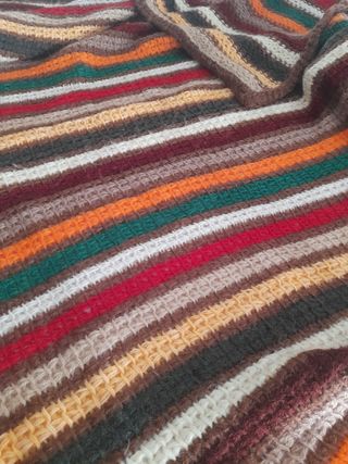 Manta  ó pié de cama.