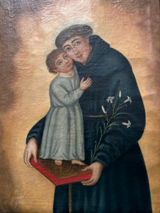 San Antonio con niño Jesús sobre la biblia.