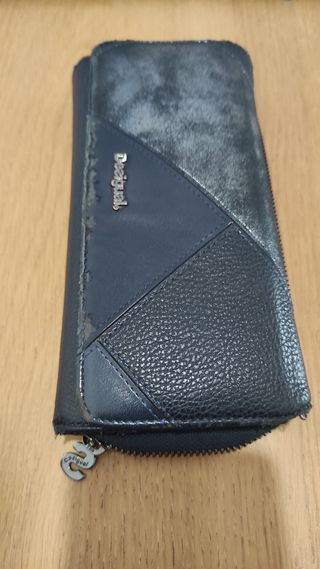 Cartera desigual bastante usada