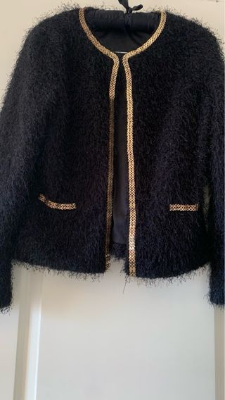 Chaqueta con ribete comunion . 