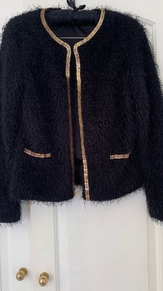 Chaqueta con ribete comunion . 