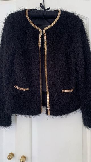 Chaqueta con ribete comunion . 