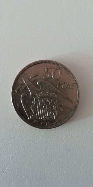 Moneda antigua del 1957