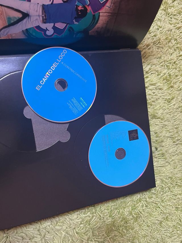 discos y libro el canto del loco