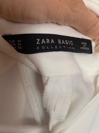 Blusa blanca con lazada al cuello talla M