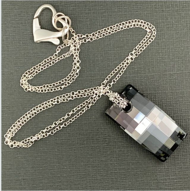 SWAROVSKI  Colgante. Pendientes. Unisex.