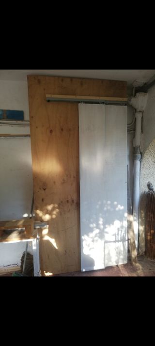 Puerta de madera corredera de doble hoja