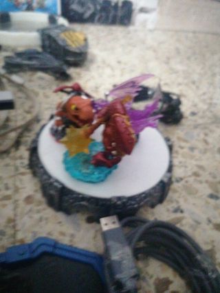 Consola Wii + figuras y juegos