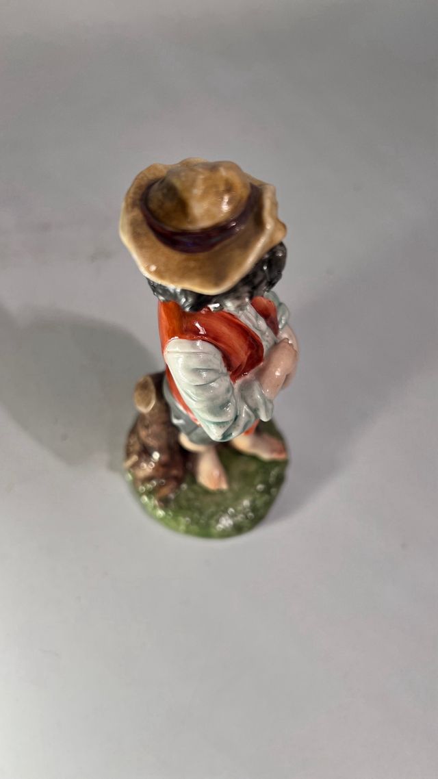 Statuetta di Capodimonte di bambino scalzo, Merli