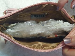 Cartera o bolso de mano rosa