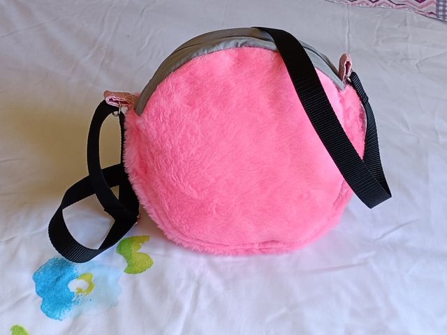 Bolso redondo pelo rosa